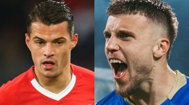 El suizo Xhaka (izq.) y el bosnio Demirovic.